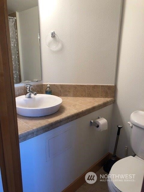 bathroom with vanity and toilet