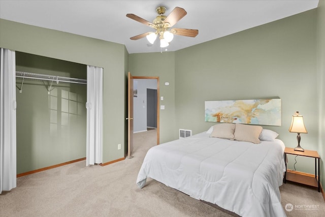 bedroom with light colored carpet, a closet, and ceiling fan