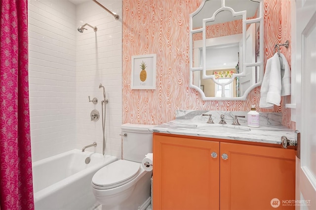 full bathroom featuring vanity, toilet, wallpapered walls, and shower / washtub combination