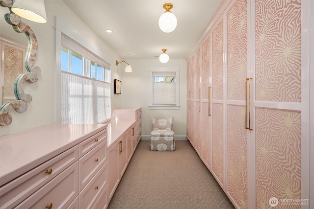 bathroom featuring vanity and baseboards