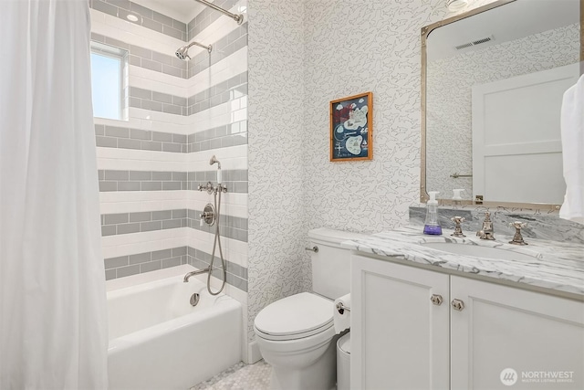 full bathroom featuring visible vents, wallpapered walls, toilet, shower / tub combo with curtain, and vanity