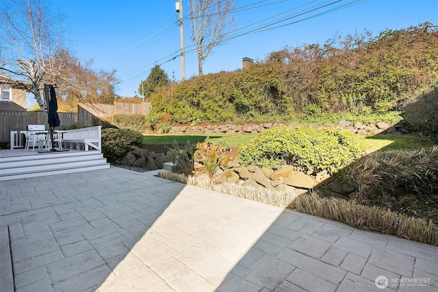 view of patio / terrace with outdoor dining space and fence