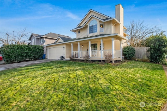 view of front of property featuring covered porch, a garage, and a front lawn