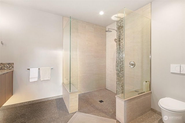 full bathroom featuring toilet, baseboards, and a walk in shower