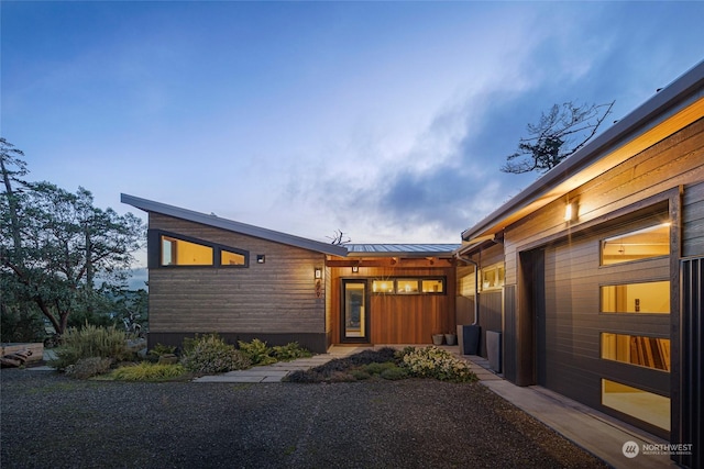 entrance to property with metal roof and a standing seam roof