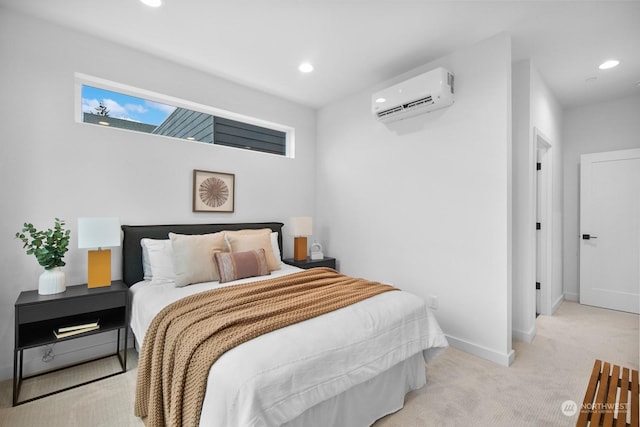 bedroom with an AC wall unit and light carpet