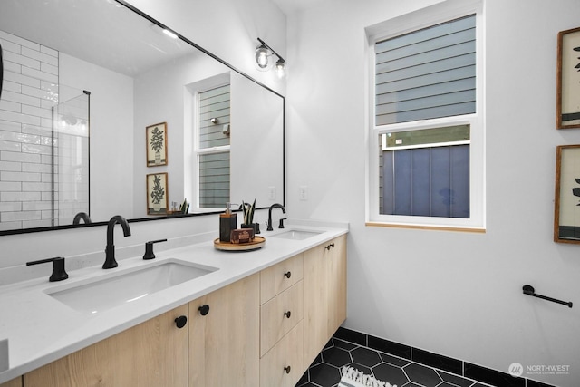 bathroom with vanity and tile patterned flooring