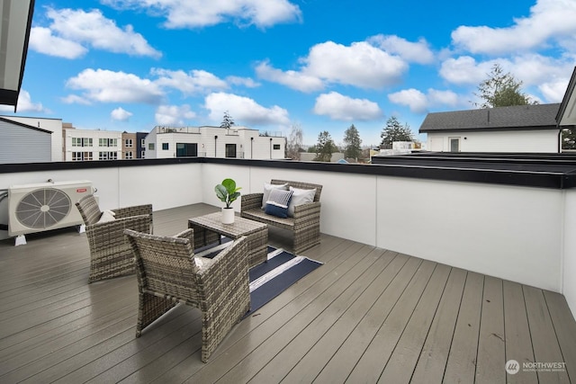 wooden terrace featuring ac unit and an outdoor hangout area