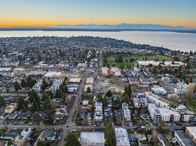 aerial view at dusk with a water and mountain view