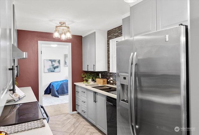 kitchen with stainless steel fridge with ice dispenser, dishwasher, sink, gray cabinets, and light parquet flooring