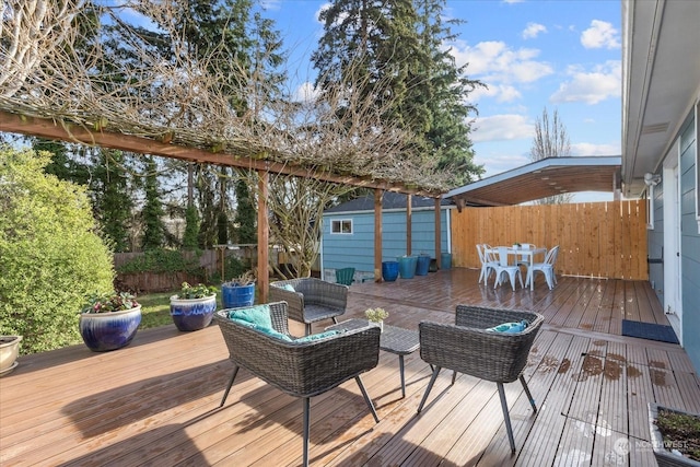 wooden terrace with an outdoor hangout area