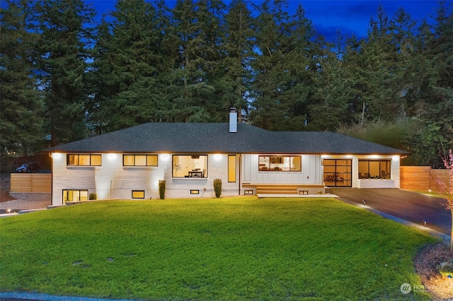 view of front of house with a yard