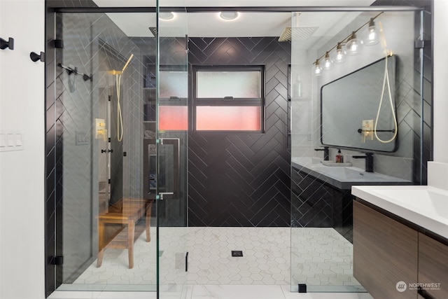 bathroom featuring an enclosed shower, vanity, and tile patterned flooring