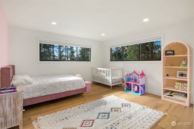 bedroom with wood-type flooring