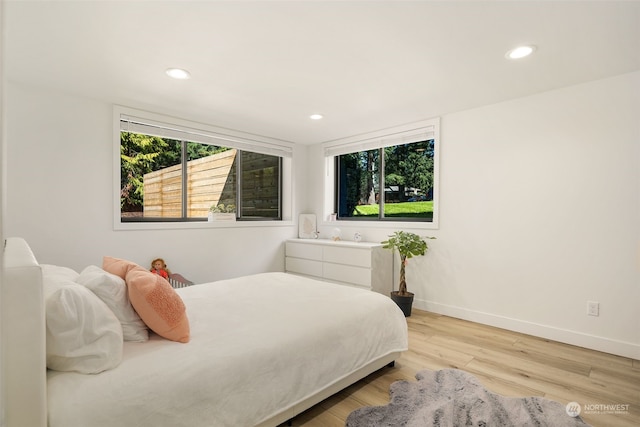 bedroom with light hardwood / wood-style floors