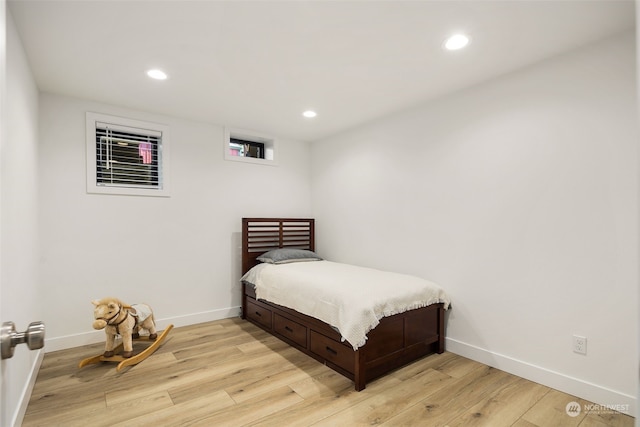 bedroom with light wood-type flooring