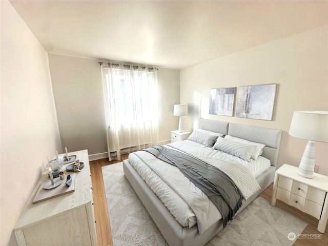 bedroom with light hardwood / wood-style flooring