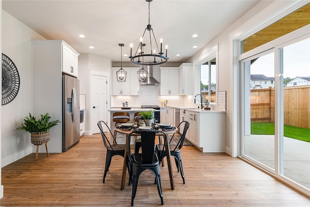 5986 Ranch Loop, Ferndale, WA 98248 - dining room with a chandelier, light wood-style flooring, and recessed lighting