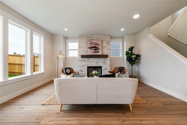 5986 Ranch Loop, Ferndale, WA 98248 - living room featuring a fireplace, baseboards, light wood-type flooring, and recessed lighting