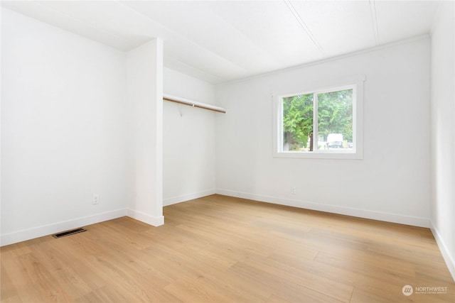 unfurnished room featuring light wood-type flooring