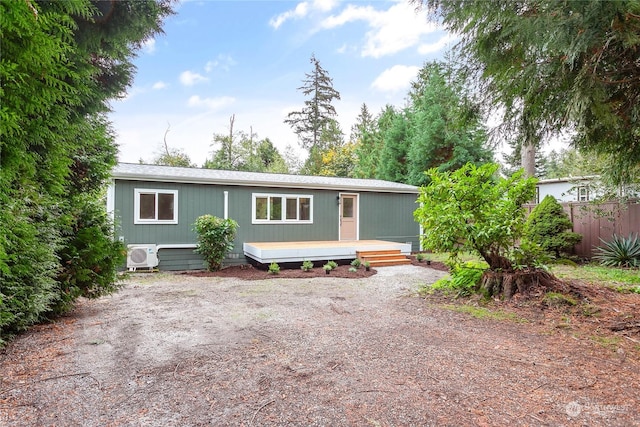 manufactured / mobile home with a deck and ac unit