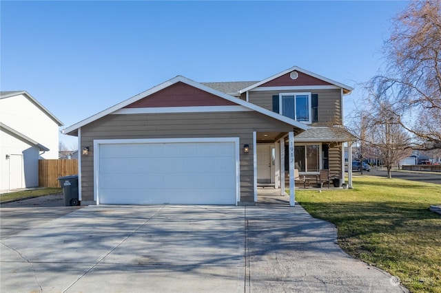 view of front of house featuring a front yard and a garage