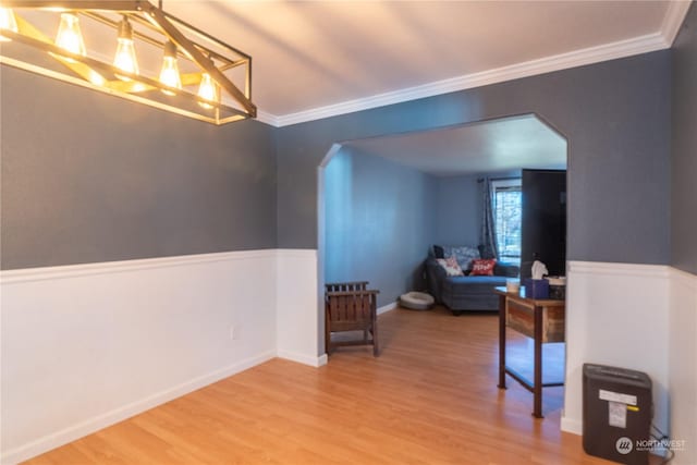 bonus room featuring hardwood / wood-style flooring and an inviting chandelier