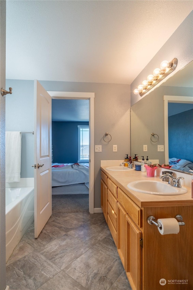 bathroom featuring a bathtub and vanity