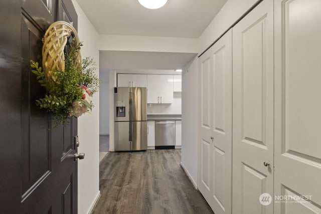 hallway with dark hardwood / wood-style floors