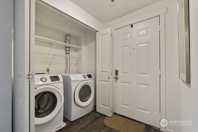 laundry area with separate washer and dryer and dark wood-type flooring