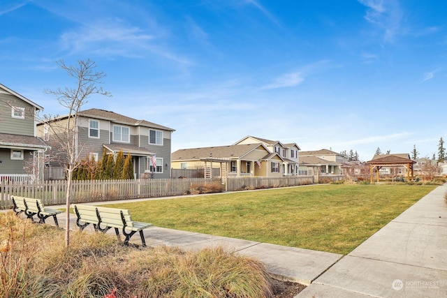 view of community featuring a lawn and a gazebo