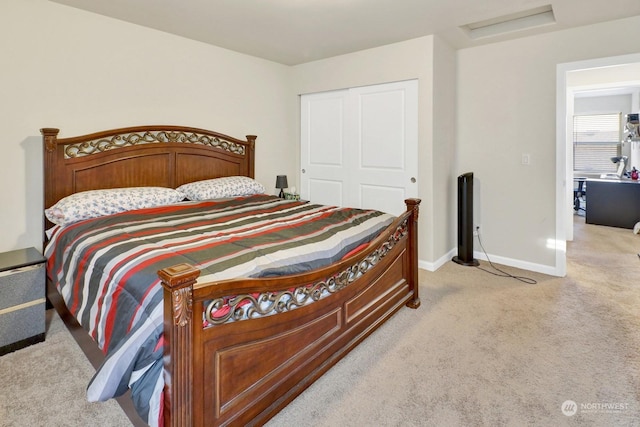 bedroom with a closet and light colored carpet