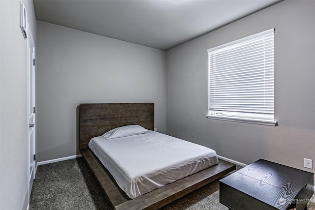 bedroom with dark carpet