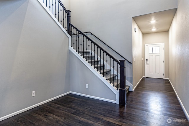 foyer entrance featuring dark hardwood / wood-style floors