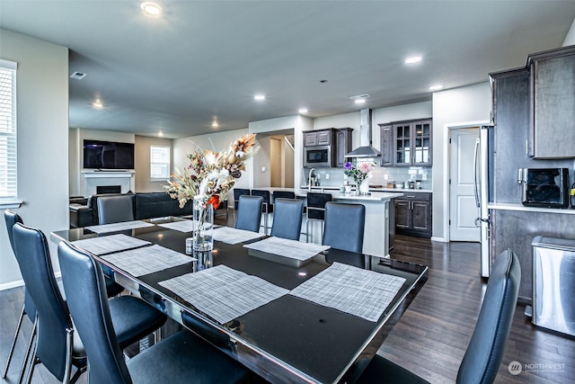 dining area with dark hardwood / wood-style floors