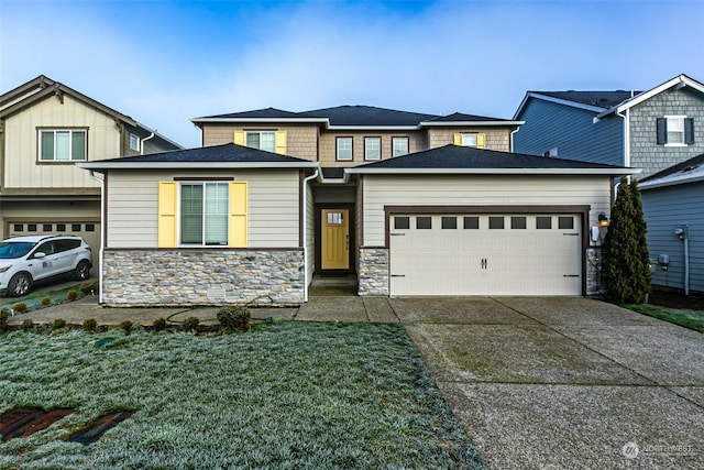 view of front of house with a garage and a front yard