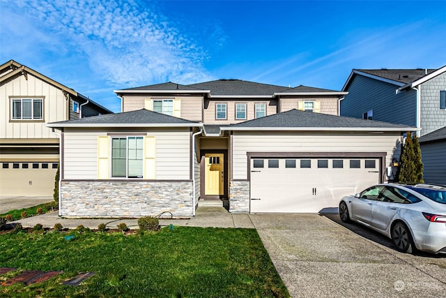 view of front facade with a front yard and a garage