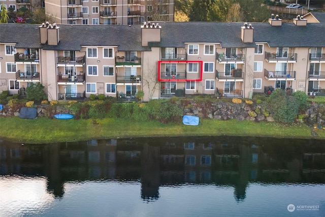 birds eye view of property featuring a water view