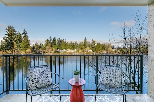 balcony featuring a water view