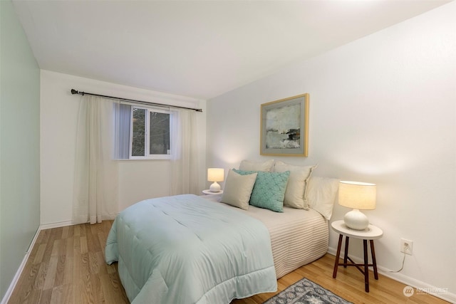 bedroom with light wood-type flooring