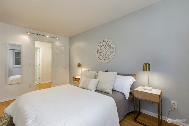 bedroom featuring hardwood / wood-style floors