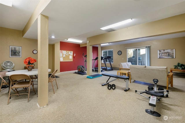 exercise area featuring carpet flooring