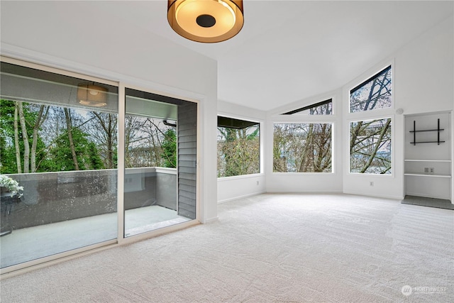 unfurnished sunroom with lofted ceiling