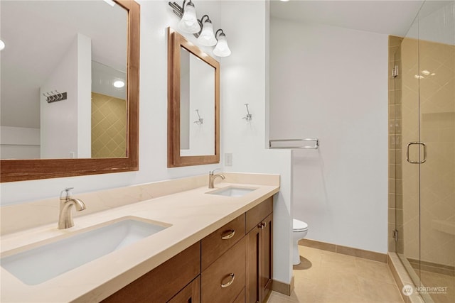 bathroom with vanity, toilet, an enclosed shower, and tile patterned flooring