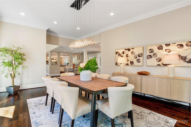 dining room with dark hardwood / wood-style flooring and crown molding