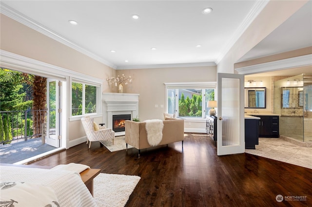 living room featuring wood-type flooring and crown molding