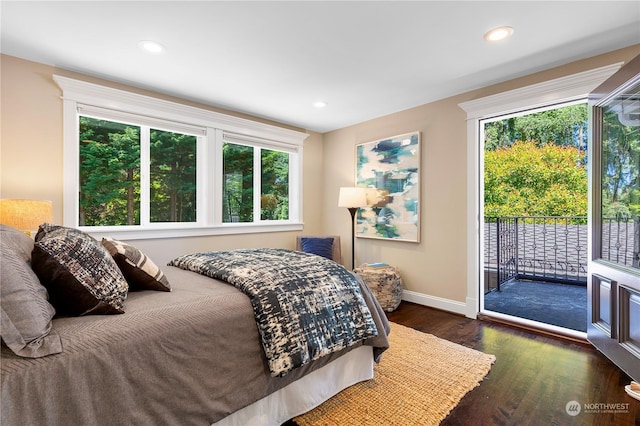 bedroom featuring access to exterior and dark hardwood / wood-style floors