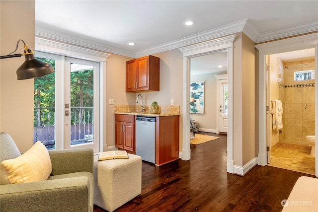 bar with sink, dark hardwood / wood-style flooring, dishwasher, and ornamental molding