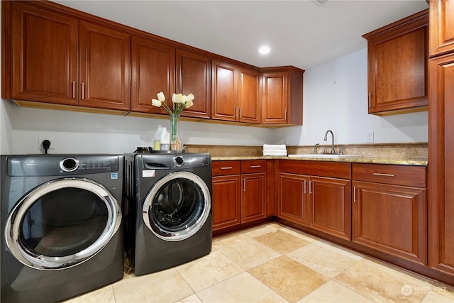 washroom featuring cabinets, light tile patterned floors, sink, and independent washer and dryer