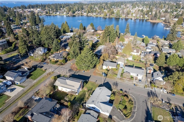 drone / aerial view featuring a residential view and a water view